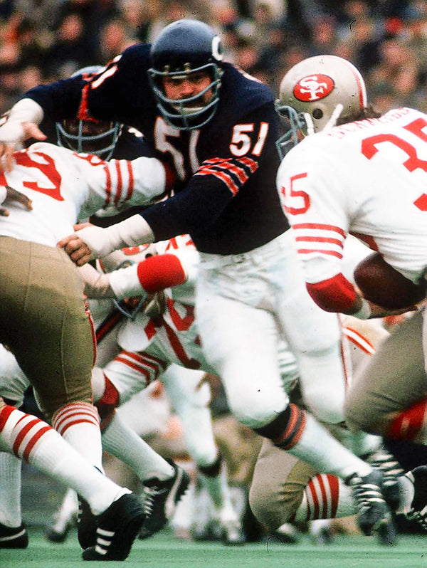 Dick Butkus rushes through the line of scrimmage against the 49ers during a game on Nov. 19, 1972. Chicago Tribune