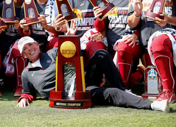 Oklahoma head coach Patty Gasso poses with the championship trophy following the final game of Women’s College World Series championship series against Florida State at USA Softball Hall of Fame Stadium in Oklahoma City, June 10, 2021. Oklahoma won 6-2. SARAH PHIPPS / THE OKLAHOMAN