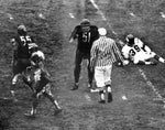 Who, me? Dick Butkus of the Bears protesting to an official after being called for roughing the kicker in the fourth quarter. The punter, Bobby Walden, is at right. The penalty started a Viking drive that wound up in a blocked field goal, Dec. 10, 1967. Chicago Tribune