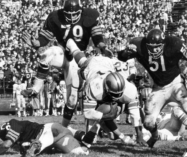 Detroit Lions ball carrier Amos Marsh is upended by John Johnson of Bears [on ground] and is about to be flattened by Dick Evey (79) and Dick Butkus (51). Butkus’ performance in the game won his first game ball and the Associated Press named him the all-NFL middle linebacker. Steve Lasker / Chicago Tribune