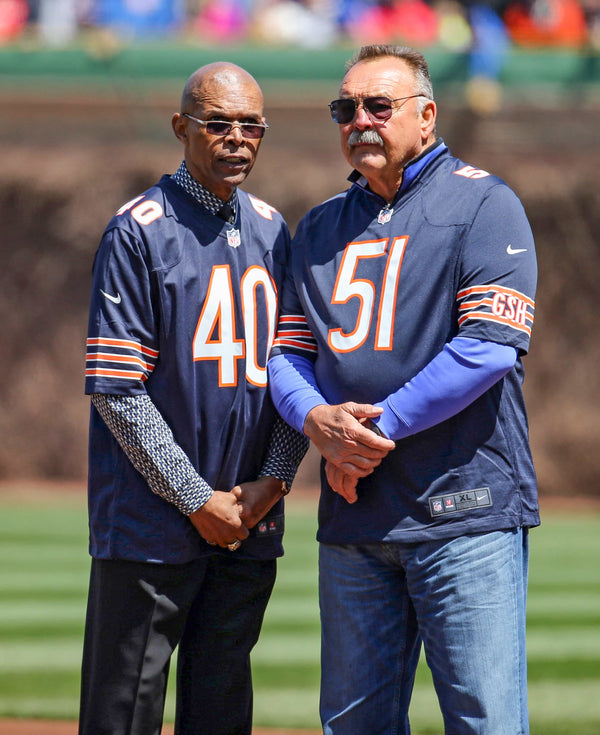 Gale Sayers and Dick Butkus represent the Chicago Bears before the game Wednesday, April 23, 2014, on Wrigley Field’s 100th birthday. Brian Cassella / Chicago Tribune