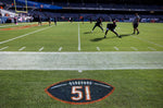 Dick Butkus’ No. 51 is painted on the field as players warm up for a game between the Chicago Bears and the Minnesota Vikings on Oct. 15, 2023. Chris Sweda / Chicago Tribune