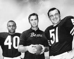 Chicago Bears coach Jim Dooley (center) stands between Gale Sayers (left) and Dick Butkus in 1968. Phil Mascione / Chicago Tribune