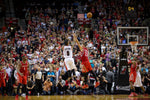 PORTLAND, OREGON - May 2, 2014 - Portland Trail Blazers guard Damian Lillard (0) hits the game winner as the Portland Trail Blazers face the Houston Rockets in game 6 of the NBA playoffs at the Moda Center in Portland, Oregon. Bruce Ely / The Oregonian
