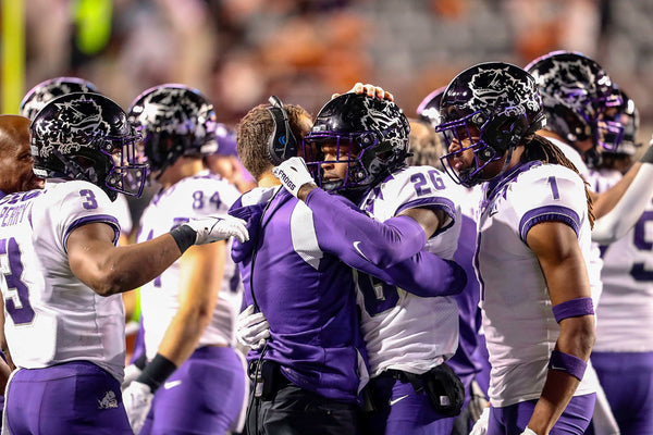 TCU wide receiver Caleb Medford hugs a coach after a touchdown was scored during their game against UT at the DKR Texas Memorial Stadium in Austin on Nov. 12, 2022. The Horned Frogs beat the Texas Longhorns 17-10, despite a sluggish first half. (Madeleine Cook / Fort Worth Star-Telegram)
