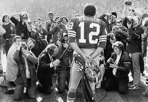 Quarterback John Brodie, seen here addressing the media in 1973, scored on a 1-yard run with under two minutes left to beat the Vikings in frigid Metropolitan Stadium. The score provided the difference in the 49ers 17-14 win in the divisional playoff round. Terry Schmitt/The Chronicle