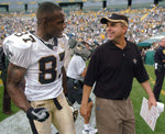Saints no. 87 WR Joe Horn walks off the field after the Saints 34-27 win with Saints head coach Sean Payton after the New Orleans Saints game against the Green Bay Packers at Lambeau Field in Green Bay, Wisconsin, Sept. 17, 2006. Susan Poag