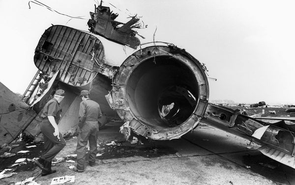 Men surveying the wreckage of United Flight 232 following the crash in 1989. Sioux City Journal