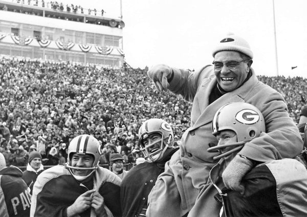 Packers coach Vince Lombardi is carried off the field by linebacker Dan Currie, center, and defensive tackle Dave Hanner, right, after Green Bay's 37-0 victory over the New York Giants in the NFL championship game at new City Stadium on Dec. 31, 1961. Fullback Jim Taylor is at left. Press-Gazette archives