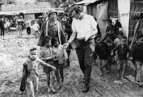 Congressman Bush interviews children using a tape recorder during his visit to Vietnam, December 26, 1967 through January 11, 1968. Photo Credit: George Bush Presidential Library and Museum (Textual Archives Collection)