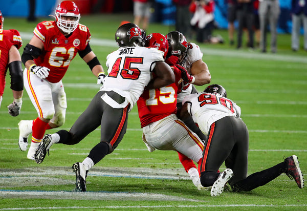 Devin White is all over the field in Super Bowl 55 and more than happy to lend a hand in toppling Chiefs quarterback Patrick Mahomes. TAMPA BAY TIMES / DIRK SHADD