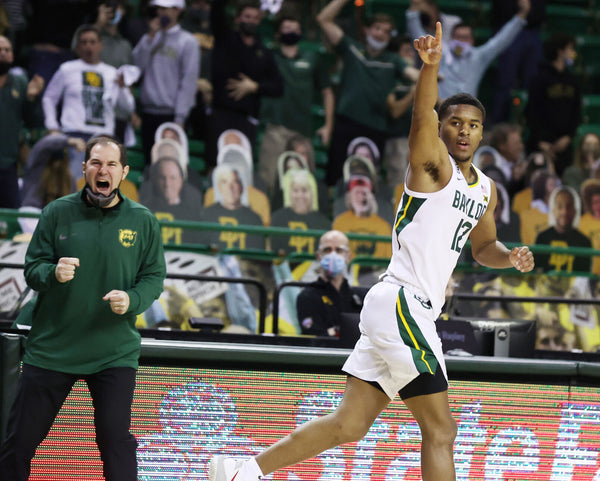 Baylor guard Jared Butler, right, reacts with head coach Scott Drew to a 3-pointer against Oklahoma State in the second half. The Bears defeated the 17th-ranked Cowboys, 81-70. Courtesy Rod Aydelotte / Waco Tribune-Herald