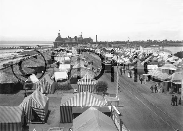 Tent City with Hotel del Coronado in the distance, circa 1904. It featured a grocery store, soda fountain, theater, police department, and a daily newspaper. The Coronado Shores condo towers occupy the site today. San Diego History Center (#858)