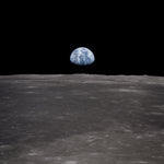 View of the Moon with Earth on the horizon. This image was taken before the separation of the LM and Command Module during the Apollo 11 Mission.