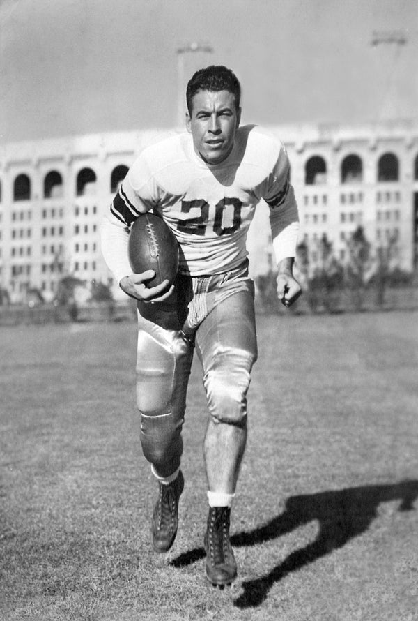 Alex Box, pictured in an undated photo in a No. 20 football uniform with Tiger Stadium in the background. LSU Athletics