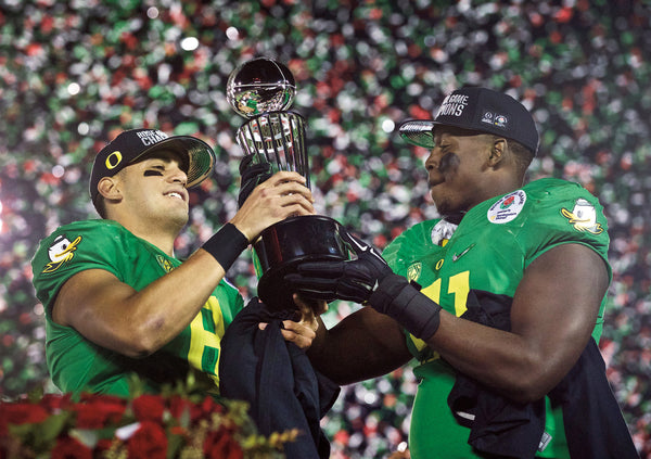 Mariota and Washington hold up the trophy after beating Florida State 59-20. They were named offensive and defensive players of the game. Thomas Boyd/The Oregonian/OregonLive