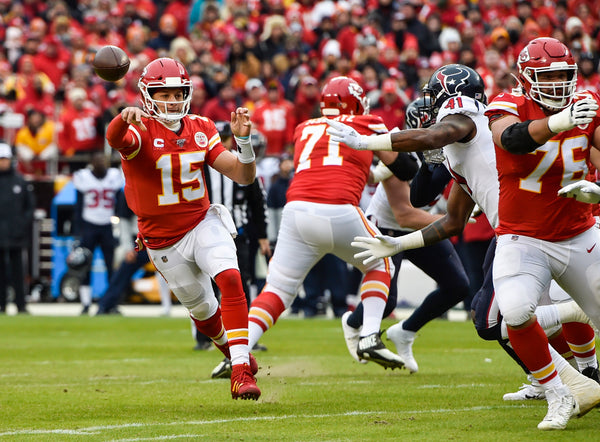 Kansas City Chiefs quarterback Patrick Mahomes throws the first touchdown pass in the second quarter to tight end Travis Kelce on January 12, 2020, at Arrowhead Stadium in Kansas City, Missouri, during the AFC divisional championship game against the Houston Texans. Courtesy Jill Toyoshiba / The Kansas City Star
