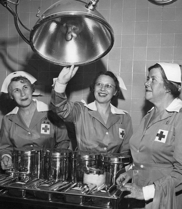 Three Gray Ladies with the women’s division in the emergency room of General Rose Memorial Hospital, Denver, April 21, 1952. From left: Mrs. Charles C. Wilmore, Miss Malvine Mandell, Mrs. C. C. Kusick. Helping with emergency cases, delivering mail, and caring for infants were among the duties of a Gray Lady. COURTESY THE DENVER POST VIA GETTY IMAGES, AL MOLDVAY, #DPL_1568354