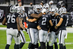 Las Vegas Raiders kicker Daniel Carlson (2) is congratulated by teammates on his late-game field goal to seal the win 34-24 over the New Orleans Saints during the fourth quarter of the Raiders home opening NFL football game at Allegiant Stadium on Sept. 21, 2020, in Las Vegas. L.E. Baskow/Las Vegas Review-Journal