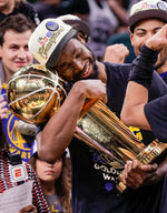 Golden State Warriors' Andrew Wiggins, 22, holds the Larry O’Brien Championship Trophy after Game 6 of the NBA Finals at TD Garden in Boston, Mass., on Thursday, June 16, 2022. Carlos Avila Gonzalez / The Chronicle