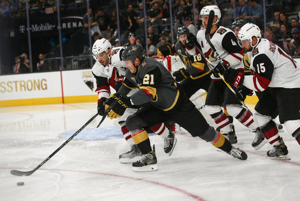 Vegas Golden Knights' Cody Eakin (21) chases down the puck against Arizona Coyotes' Jason Demers, left, during an NHL hockey game at T-Mobile Arena in Las Vegas on Tuesday, Oct. 10, 2017. The Golden Knights won 5-2. Courtesy Chase Stevens/Las Vegas Review-Journal