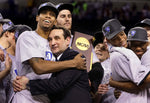 Duke coach Mike Krzyzewski hugs senior forward Lance Thomas while Brian Zoubek clutches the school's fourth NCAA championship trophy following the 2010 title game in Indianapolis. Chuck Liddy/The News & Observer