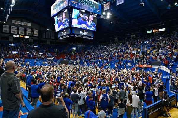 KU fans storm the court at Allen Fieldhouse and celebrate a historic comeback victory after the Jayhawks rally from a 15-point deficit to defeat North Carolina for the NCAA national championship, April 4, 2022. Tammy Ljungblad / The Kansas City Star