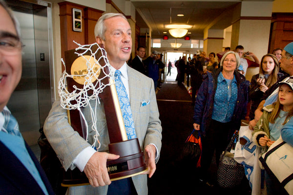 Roy Williams is greeted by fans as he and his wife Wanda leave the team hotel with the 2009 NCAA trophy. Courtesy Robert Willett / The News & Observer