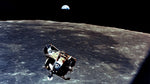 With a half-Earth in the background, the Lunar Module with moon-walking astronauts Neil Armstrong and Buzz Aldrin approaches for a rendezvous with the Apollo Command Module, manned by Michael Collins. The Apollo 11 liftoff from the moon came early, ending a 22-hour stay by Armstrong and Aldrin. CourtesyNASA