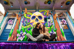 Love in the time of Mardi Gras and a coronavirus pandemic: Demian and Angela Estevez kiss through their masks while hanging out on their house float, ‘The Night Tripper.’ Chris Granger / The Times-Picayune | The Advocate