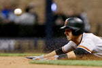 Buster Posey of the San Francisco Giants slides into second base for a stolen base in the eighth inning against the Milwaukee Brewers at Miller Park on June 5, 2017, in Milwaukee, Wis. Dylan Buell / Getty Images