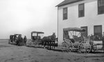 Horse-drawn carriages parked in front of the Farson Hotel in 1908. Wyoming State Archives