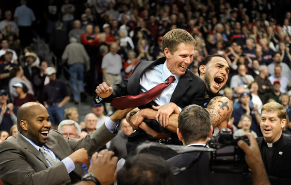 Gonzaga center Robert Sacre grabs head coach Mark Few and carries him to the rest of the team after the Zags beat Saint Mary’s for the WCC Tournament Championship on March 7, 2011, in Las Vegas. Christopher Anderson / The Spokesman-Review