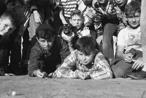 Two sixth-graders at Adams Elementary School were marble champs in the first day’s tournament sponsored by The San Diego Union and the city Parks and Recreation Department on February 18, 1952. They are Johnny Giamancio (left) and Ronnie Franklin. The original front-page caption read the “dog distrusted the photographer,” Ted Lau. The rules held that nine marbles be placed in a 7-foot ring and each contestant had to shoot out five. CourtesyUnion-Tribune