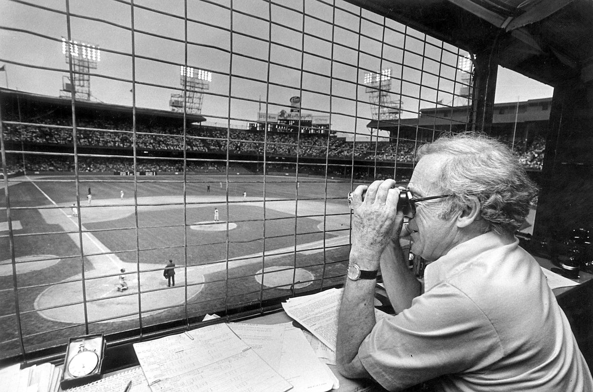 Ernie Harwell takes a closer look at the action on the Tiger Stadium field. Scott Eccker / Detroit Free Press