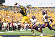 Roman Wilson hauls in his third touchdown catch, a 15-yarder early in the third quarter, Sept. 2, 2023. “I was just doing my job,” he said. “I was dying. It was hot. I know I’m from Hawaii, but it was hot out there today.” JUNFU HAN/DETROIT FREE PRESS