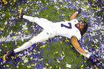 Junior tailback Donovan Edwards, the MVP of the 2022 title game, celebrates another title by doing confetti angels.  JUNFU HAN/DETROIT FREE PRESS