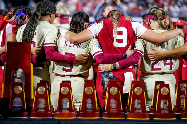 Players from OU and FSU pray after OU won the Women’s College World Series against Florida State at USA Softball Hall of Fame Stadium in Oklahoma City on June 8, 2023. NATHAN J. FISH / THE OKLAHOMAN
