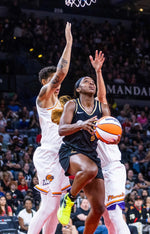 Aces guard Jackie Young (0) looks to shoot a reverse layup past Phoenix Mercury center Brittney Griner (42) during the first half of the game at the Michelob ULTRA Arena, July 11, 2023, in Las Vegas. L.E. Baskow / Las Vegas Review-Journal