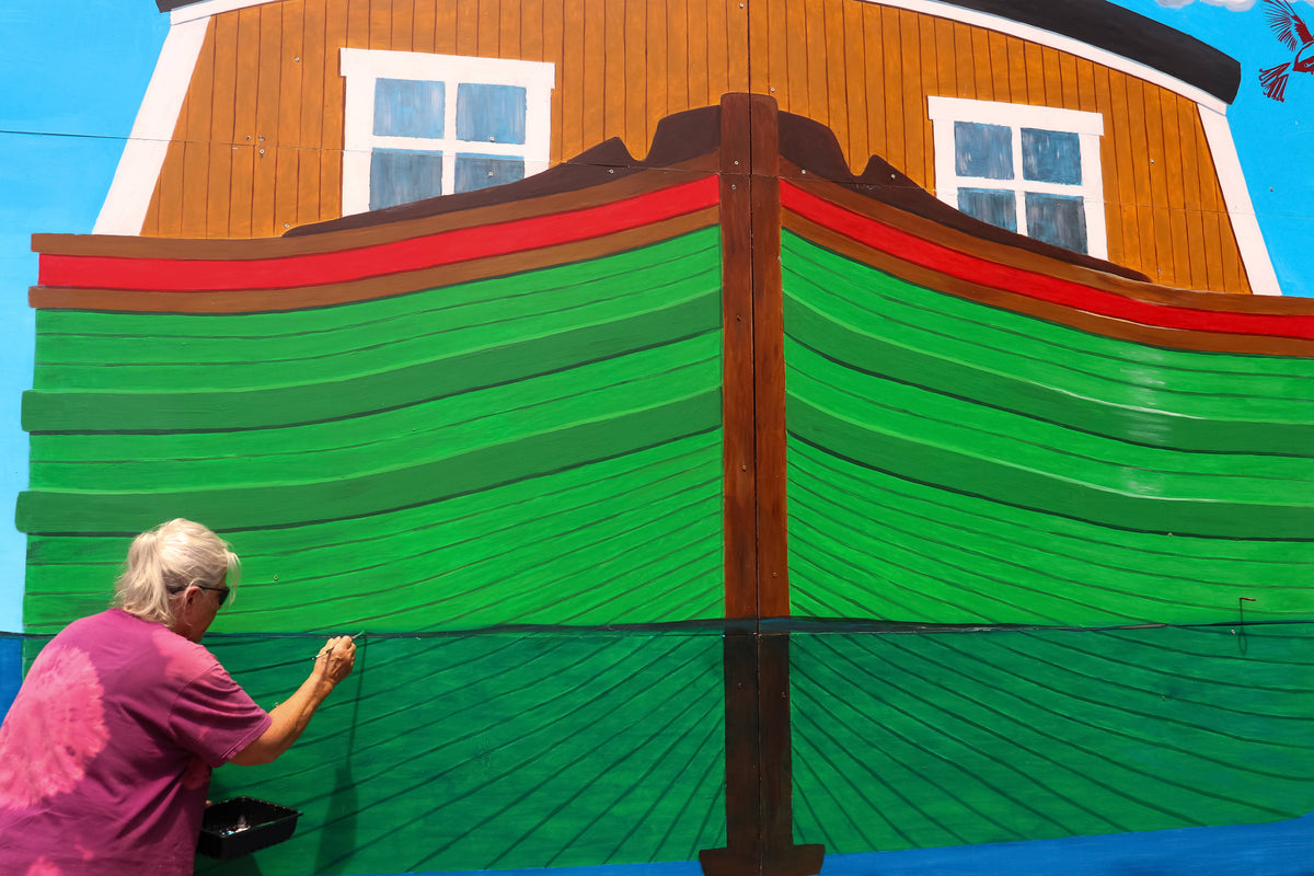 Beverly Owen works at Liz and Dave Beebe Camillus Erie Canal Park in Onondaga County on a mural that is part of the Mural Mania project. Julia Carden / Democrat and Chronicle