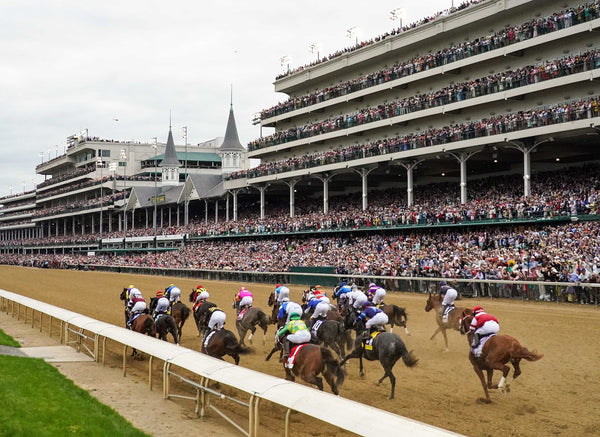 The field for the 148th running of the Kentucky Derby passes the grandstands on May 7, 2022. Michael Clevenger and Christopher Granger / The Courier Journal