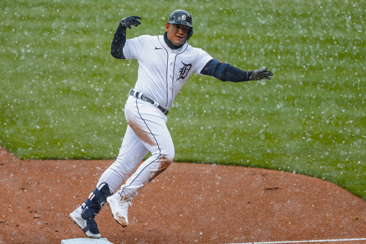 Detroit Tigers first baseman Miguel Cabrera celebrates as he rounds the bases in the snow after hitting a two-run home run during the first inning against the Cleveland Indians on Opening Day at Comerica Park on April 1, 2021. Raj Mehta / USA TODAY Sports