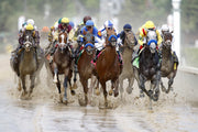 The field makes its first pass by the finish line during a muddy 2010 Kentucky Derby. Michael Clevenger / The Courier Journal