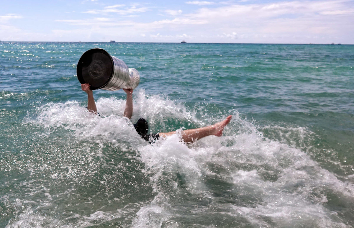 Florida Panthers Matthew Tkachuk celebrates winning the Stanley Cup in the Atlantic Ocean near Elbo Room in Fort Lauderdale on June 25, 2024.