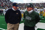 Michigan coach Lloyd Carr, left, and Michigan State coach Nick Saban chat before the game on Nov. 14, 1995, in East Lansing, Mich. Alan R. Kamuda / Detroit Free Press
