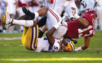 LSU safety Marcel Brooks (9) tackles Alabama quarterback Tua Tagovailoa (13) after he released a pass at Bryant-Denny Stadium in Tuscaloosa, Ala., on Nov. 9, 2019. Mickey Welsh / Montgomery Advertiser via Imagn Content Services, LLC