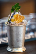 Mixologist Natalie White's "The Lucky Debonair" spin on a Four Roses mint julep during the Kentucky Derby Festival's Festival Unveiled event Wednesday evening at the Mellwood Arts Center, March 16, 2022. Alton Strupp / The Courier Journal