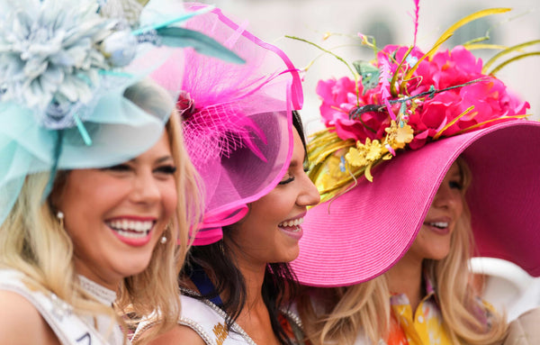Miss Michigan Melissa Beyrand, left, Miss New Jersey Augostina Mallous, center, and  Miss Ohio Elizabetta Nies, right, laugh while greeting guests outside the paddock of the Kentucky Derby on Saturday at Churchill Downs in Louisville, May, 6, 2023. Matt Stone / The Courier Journal