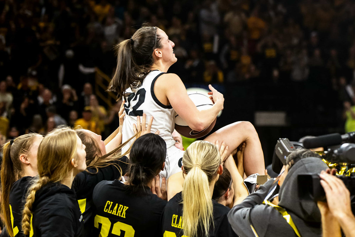 Iowa guard Caitlin Clark (22) is lifted by teammates after an NCAA Big Ten Conference women's basketball game against Michigan, Feb. 15, 2024, at Carver-Hawkeye Arena in Iowa City, Iowa. Joseph Cress / Des Moines Register