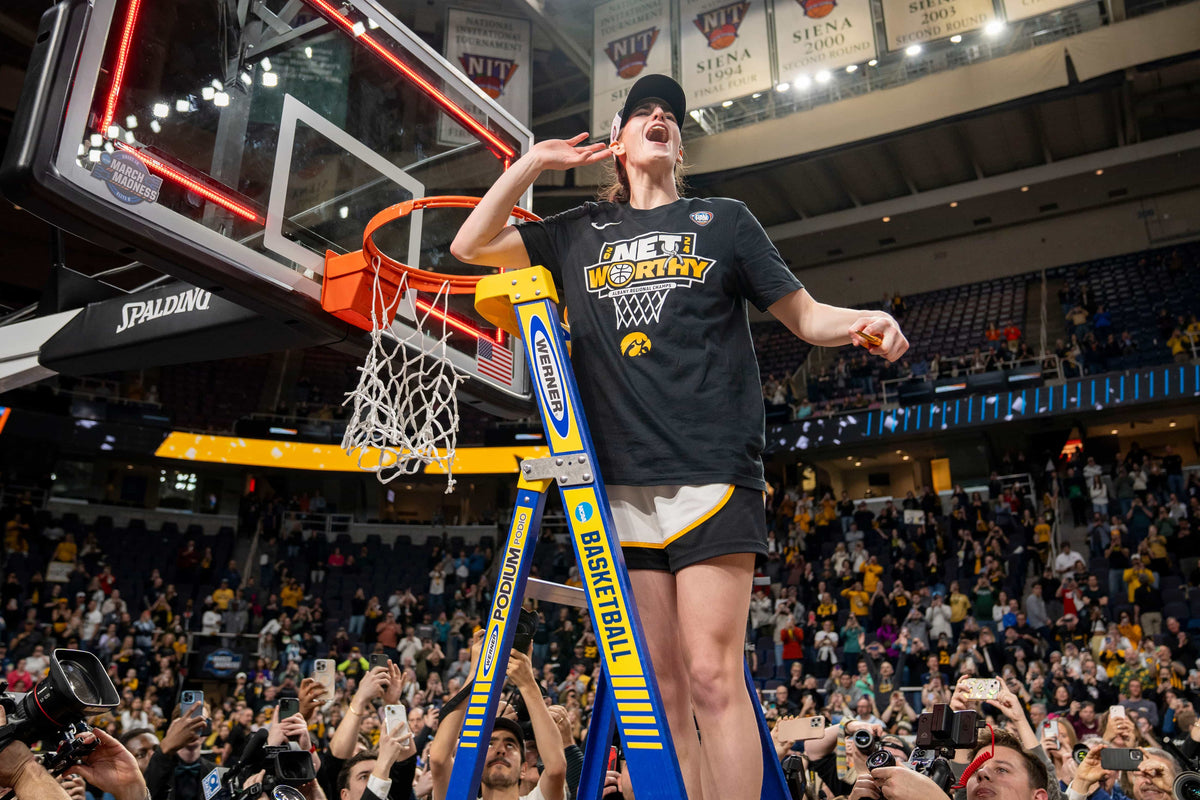 Iowa Hawkeyes guard Caitlin Clark (22) cuts down the net after beating LSU in the Elite Eight round of the NCAA Women's Basketball Tournament between Iowa and LSU at MVP Arena, April 1, 2024, in Albany, N.Y. Zach Boyden-Holmes / Des Moines Register